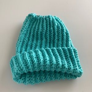 Turquoise hand made bun hat.